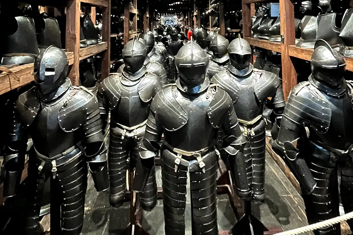 Rows of historic armor displayed at the Landeszeughaus in Graz, resembling a terracotta army formation