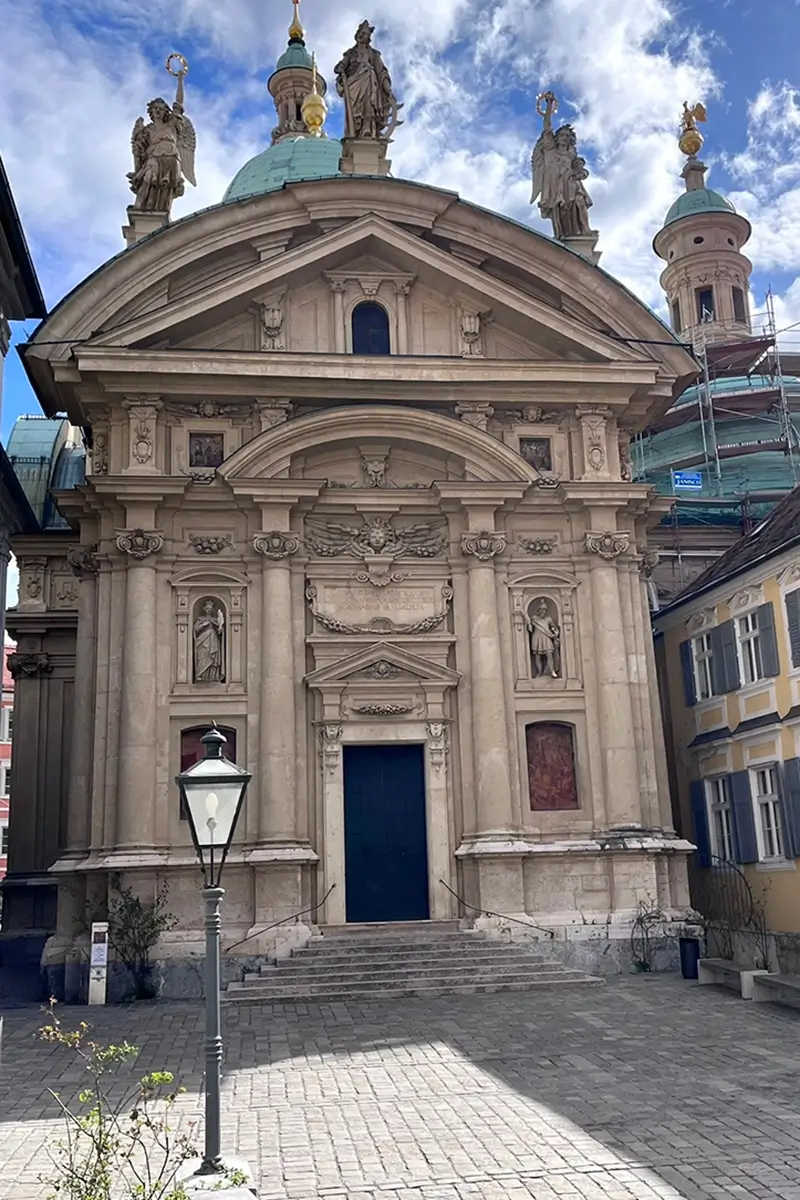 Front view of the Mausoleum in Graz with its ornate baroque façade and dome, highlighting things to do in Graz.