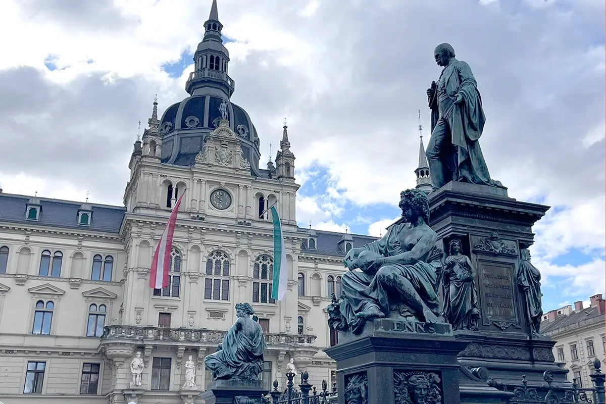 Graz Rathaus in Hauptplatz with the Archduke Johann Fountain in the foreground, highlighting things to do in Graz.