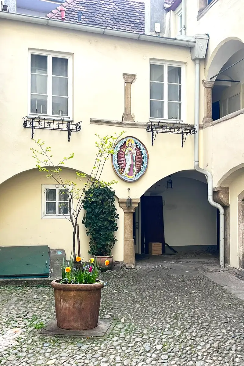 Courtyard of the Hof des Deutschen Ritterordens in Graz with historic arches and Renaissance architecture