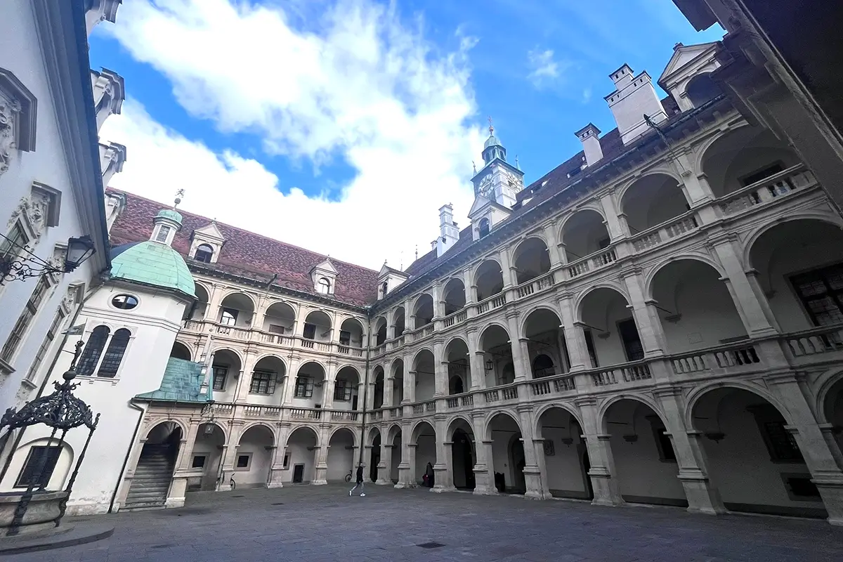 Arcaded walkways, Tuscan columns, and bronze fountain in the Landhaus courtyard, highlighting things to do in Graz
